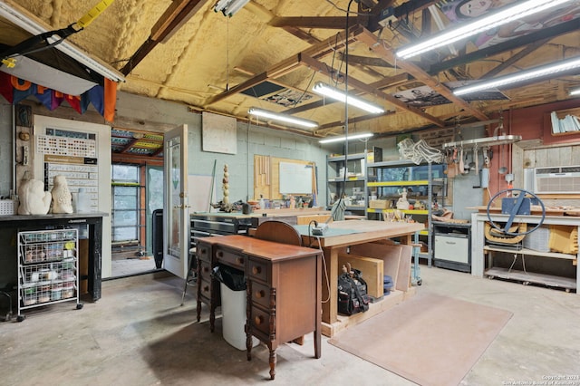 interior space featuring a workshop area and concrete floors