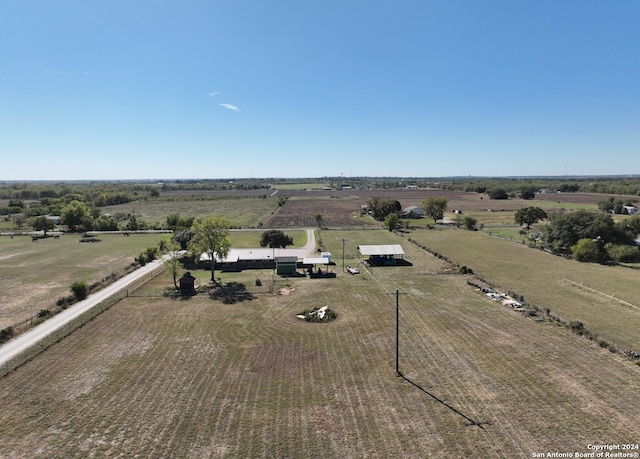 birds eye view of property featuring a rural view