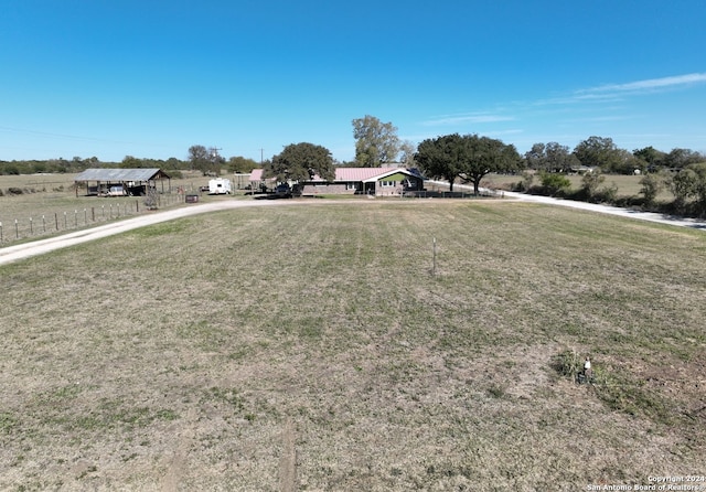 view of yard with a rural view