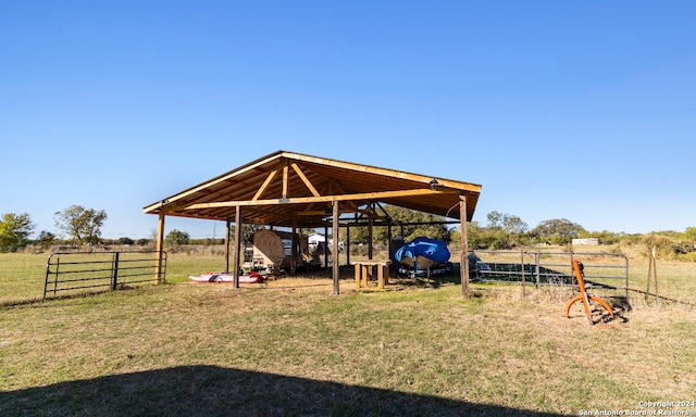 view of yard featuring an outbuilding and a rural view