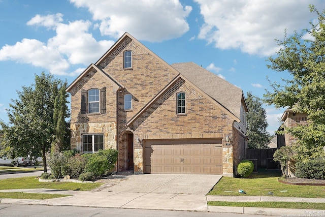 102 Santa Anita, Boerne, TX 78006 - view of front of home with brick siding, a garage, stone siding, and driveway