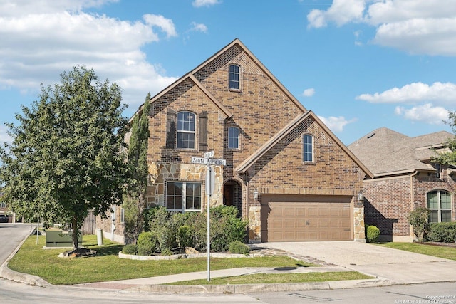 102 Santa Anita, Boerne, TX 78006 - view of front of property with brick siding, a front yard, concrete driveway, stone siding, and a garage