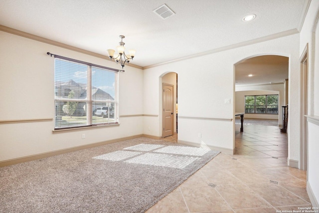 102 Santa Anita, Boerne, TX 78006 - spare room featuring arched walkways, crown molding, a chandelier, baseboards, and light tile patterned floors