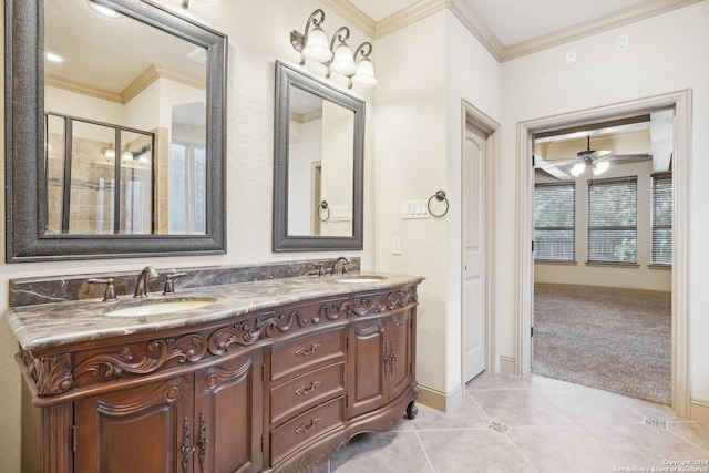 bathroom with tile patterned flooring, vanity, ceiling fan, and ornamental molding