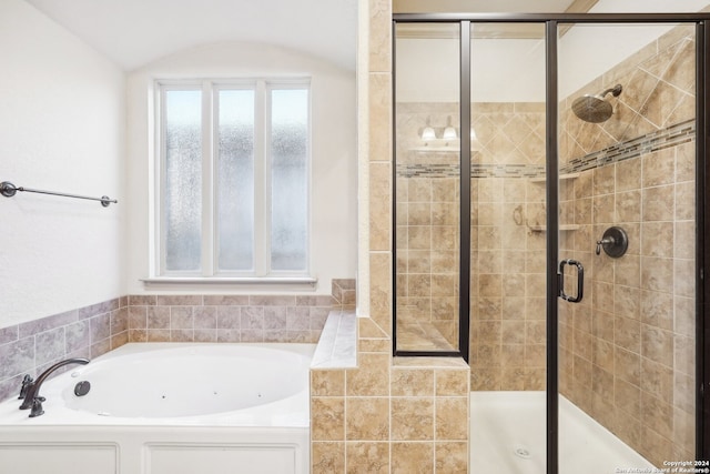 bathroom with separate shower and tub