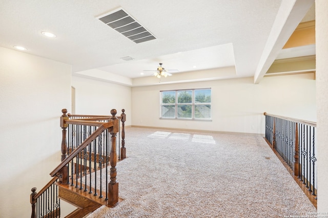 bonus room featuring ceiling fan, beam ceiling, and carpet floors