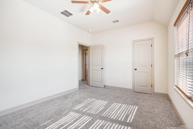 102 Santa Anita, Boerne, TX 78006 - unfurnished bedroom featuring carpet flooring, multiple windows, lofted ceiling, and baseboards