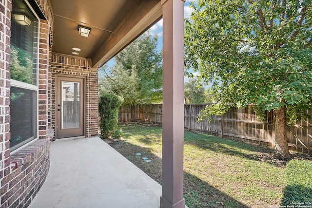 exterior space featuring a yard and a patio