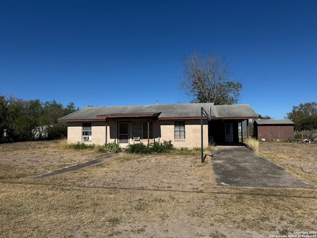 view of front of property with a carport