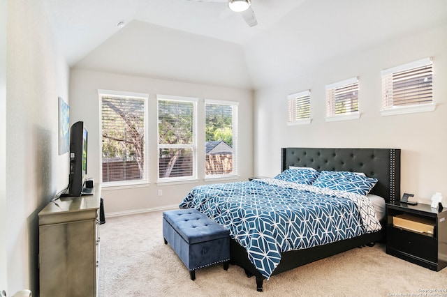 bedroom with ceiling fan, carpet floors, and vaulted ceiling