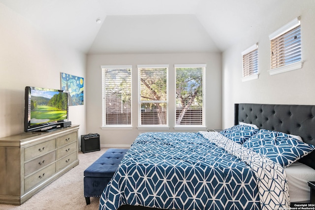 carpeted bedroom featuring vaulted ceiling