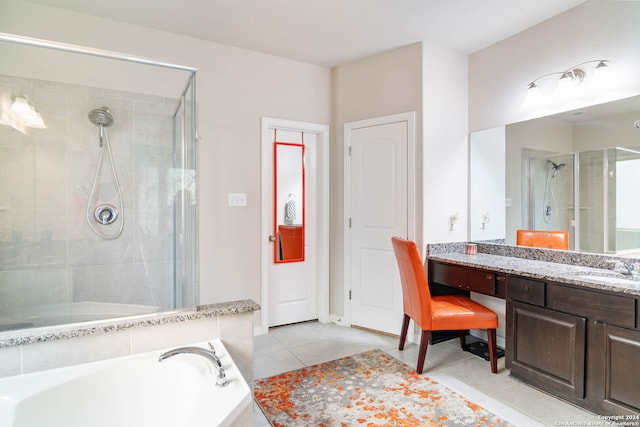 bathroom featuring separate shower and tub, tile patterned floors, and vanity