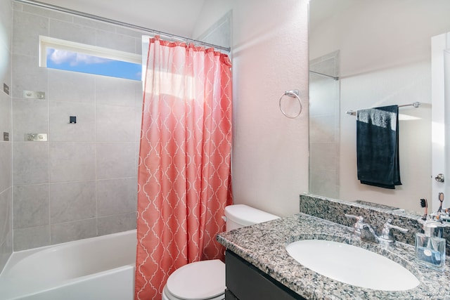 full bathroom featuring lofted ceiling, vanity, toilet, and shower / bath combo with shower curtain