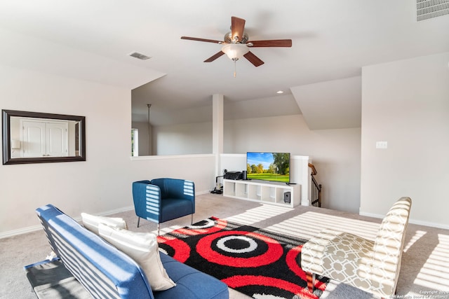 living room featuring ceiling fan and carpet