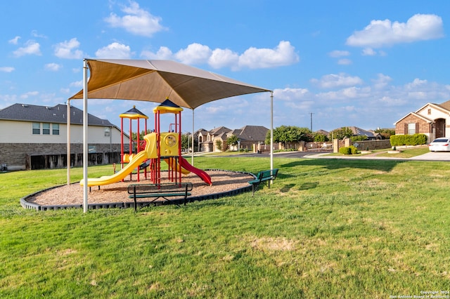 view of playground with a yard