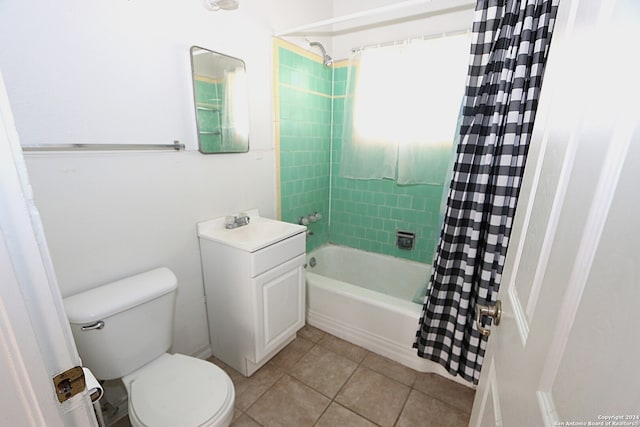 full bathroom featuring tile patterned flooring, toilet, shower / bathtub combination with curtain, and sink