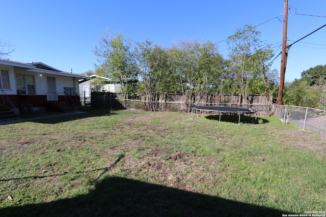 view of yard featuring a trampoline