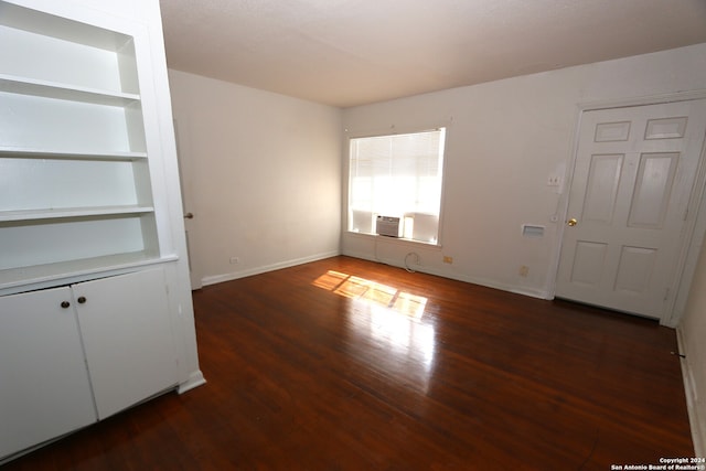 spare room featuring dark hardwood / wood-style flooring