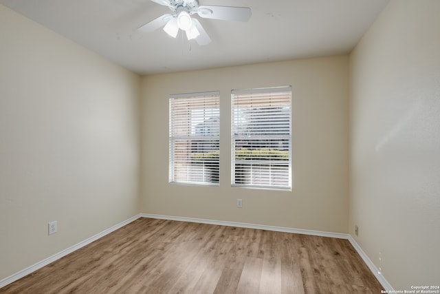 spare room with ceiling fan and light hardwood / wood-style floors