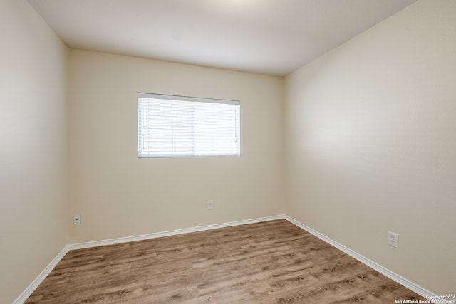 spare room featuring light wood-type flooring