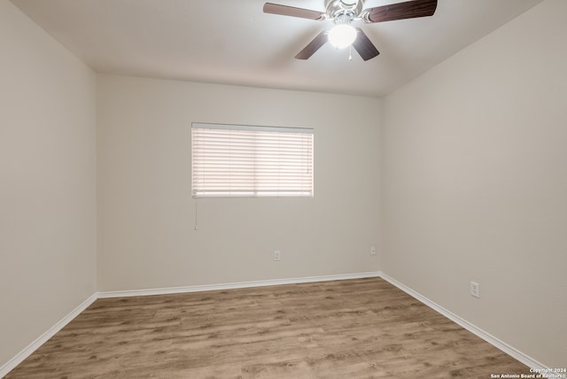 spare room with light hardwood / wood-style flooring and ceiling fan