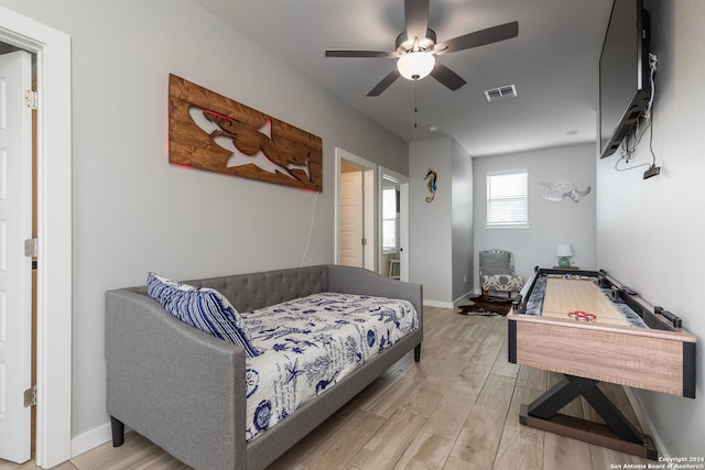 bedroom featuring ceiling fan and light wood-type flooring