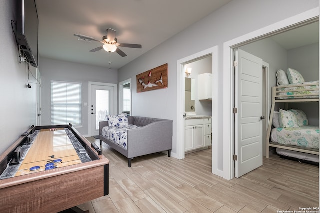 game room with ceiling fan and light hardwood / wood-style flooring