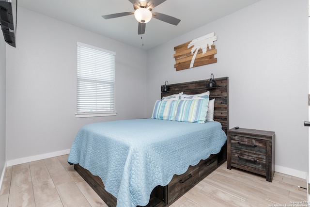 bedroom featuring ceiling fan and light hardwood / wood-style floors