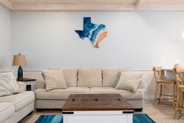 living room with light hardwood / wood-style flooring and wood ceiling