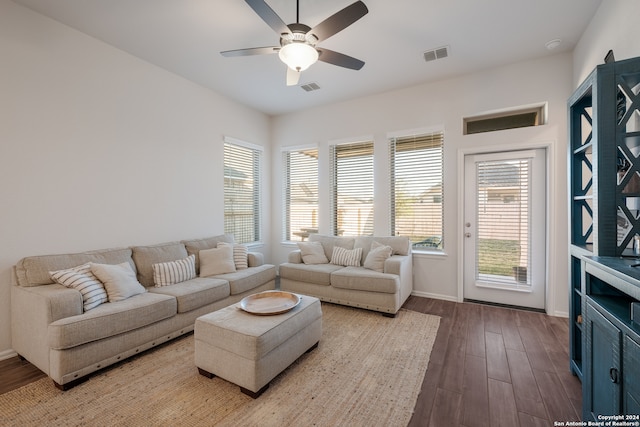 living room featuring hardwood / wood-style flooring and ceiling fan