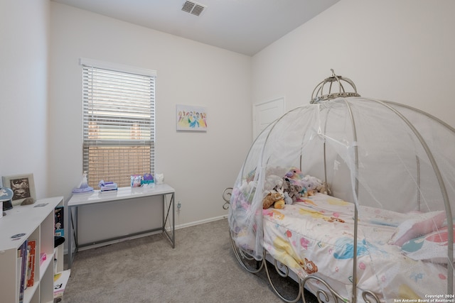 bedroom with light colored carpet