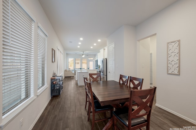 dining room with dark hardwood / wood-style floors and ceiling fan