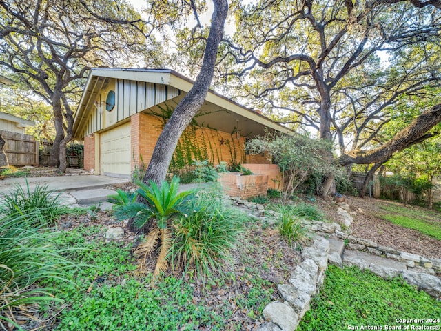 view of side of property featuring a garage