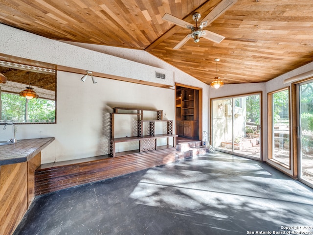 unfurnished living room featuring lofted ceiling and wooden ceiling