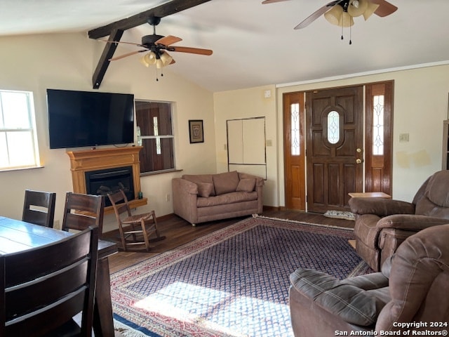 living room with hardwood / wood-style floors, vaulted ceiling with beams, and ceiling fan