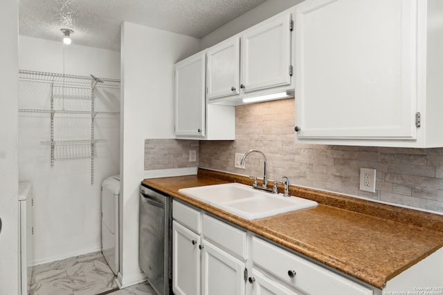 kitchen featuring white cabinets, dishwasher, and sink