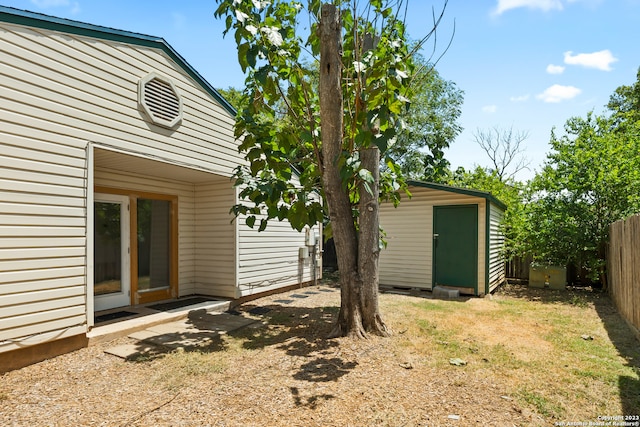 exterior space with a shed