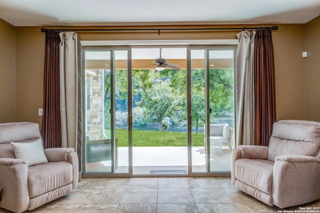 entryway featuring ceiling fan and light tile patterned floors