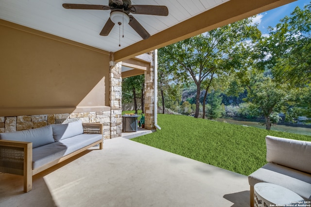 view of patio / terrace featuring ceiling fan and an outdoor living space