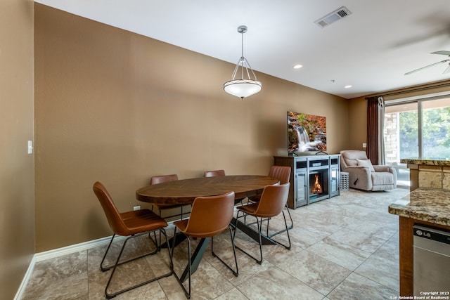 dining room featuring ceiling fan