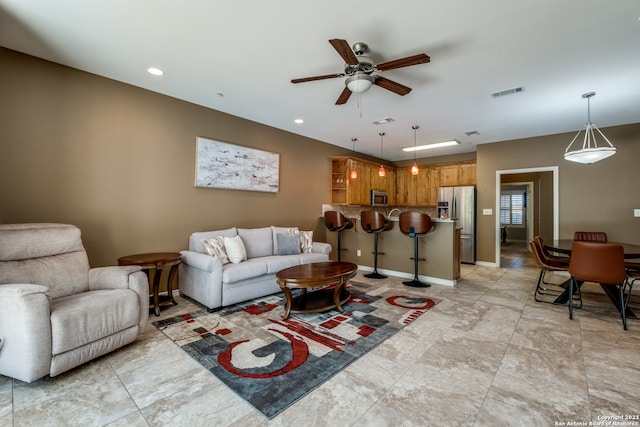 living room with ceiling fan