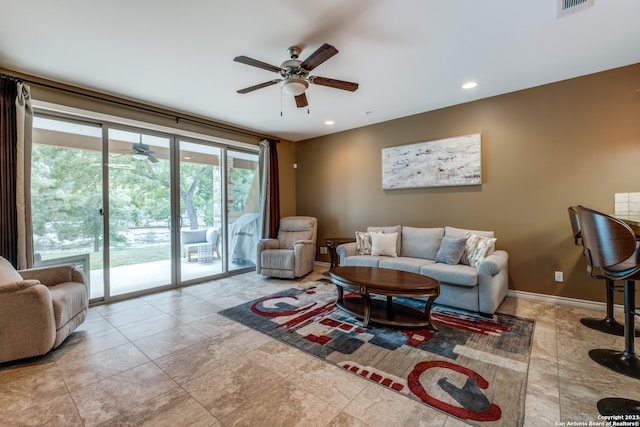 tiled living room with ceiling fan