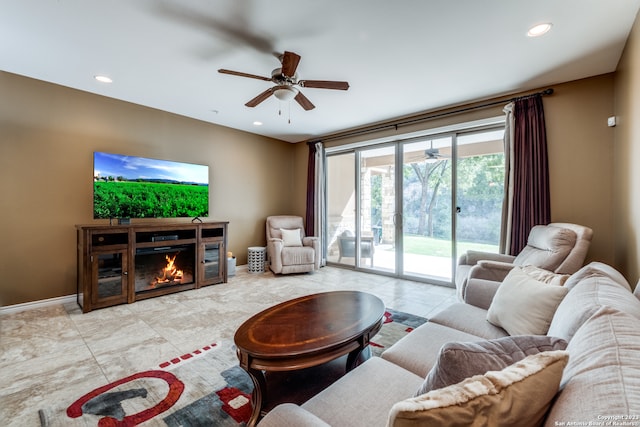 living room featuring light tile patterned floors and ceiling fan