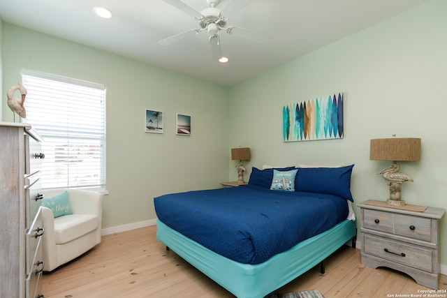 bedroom featuring light hardwood / wood-style floors and ceiling fan