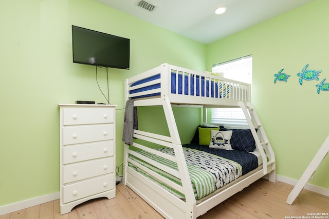 bedroom with light hardwood / wood-style floors