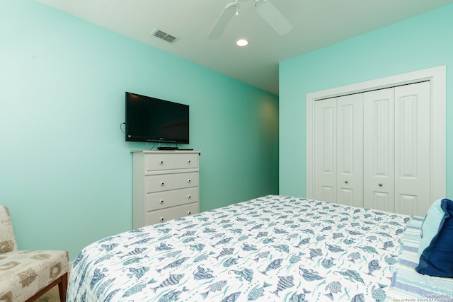 bedroom featuring ceiling fan and a closet