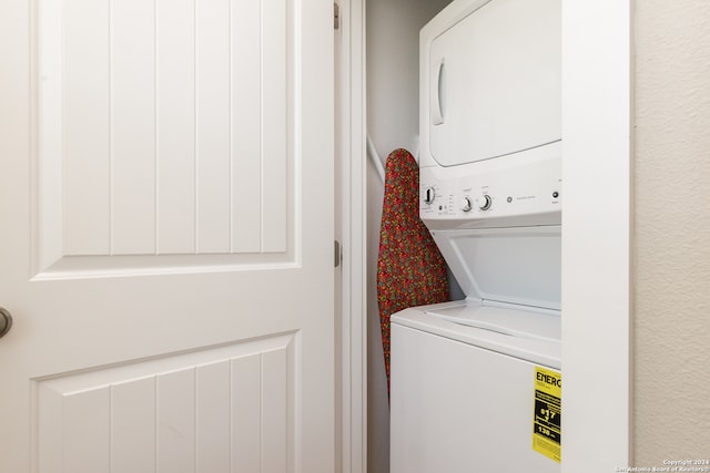 clothes washing area with stacked washer / drying machine