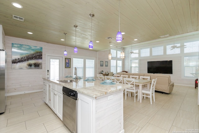 kitchen with sink, decorative light fixtures, wooden ceiling, white cabinetry, and an island with sink