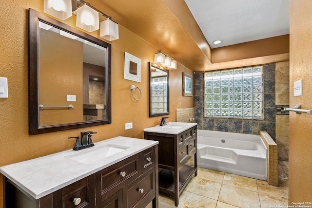 bathroom featuring tile patterned flooring, a washtub, and vanity