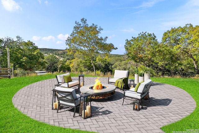 view of patio featuring a fire pit